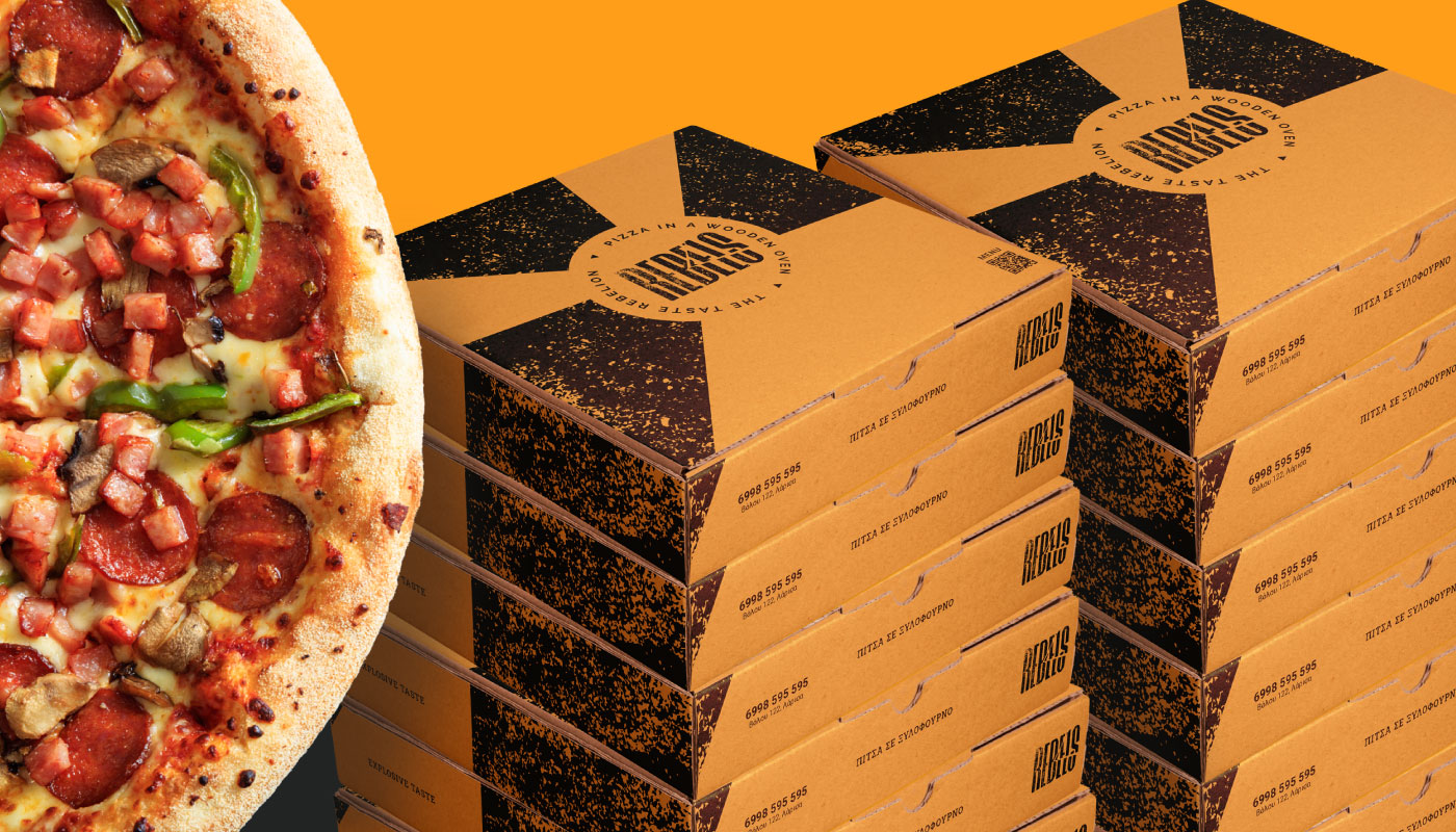 Stacks of custom kraft pizza boxes for Rebels Pizza featuring a distressed black geometric design and circular badge logo, placed next to a fresh wood-fired pizza against an orange background.