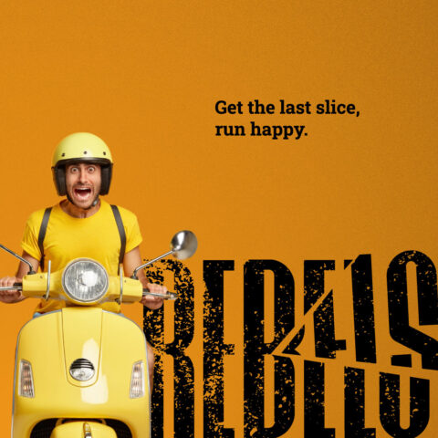 A dynamic campaign ad for REBELS Pizza showing an ecstatic delivery driver in a yellow helmet on a scooter, next to the bold, grunge-textured black cut-wordmark logo against an orange background. Brand identity designed by MVOG Studio.