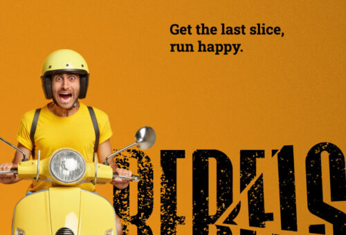 A dynamic campaign ad for REBELS Pizza showing an ecstatic delivery driver in a yellow helmet on a scooter, next to the bold, grunge-textured black cut-wordmark logo against an orange background. Brand identity designed by MVOG Studio.